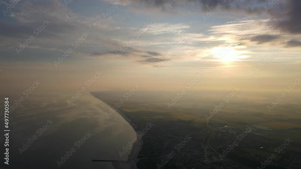 Aerial view of a beautiful morning fog at the ocean close to Løkken by the North Sea, Denmark Aerial view of a beautiful morning fog at the ocean close to Løkken by the North Sea, Denmark