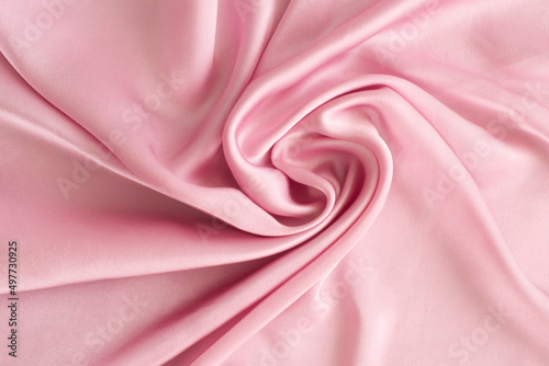 close up of silk satin texture- pink natural tone slow fashion concept 