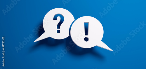Question mark and exclamation mark speech bubbles in front of a blue colored wall - 3D illustration