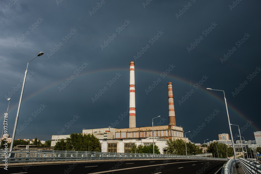 View of a thermal power station with a rainbow View of a thermal power station with a rainbow