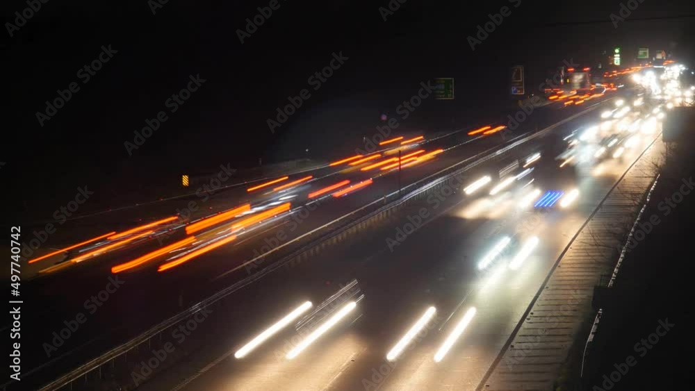 Busy time lapse traffic at night. Seamless loop for use as a background Busy time lapse traffic at night. Seamless loop for use as a background