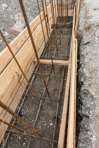 Reinforcement of the strip foundation, lower layer of reinforcement, unfinished formwork