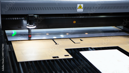 Digital die cutter machine cutting plastic acrylic. Industrial manufacture. © Itsanan