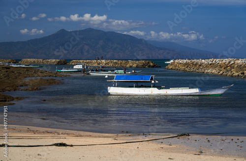 Beach with fishing boat in Asia. Sikka Regency, East Nusa Tenggara, Flores, Indonesia. photo