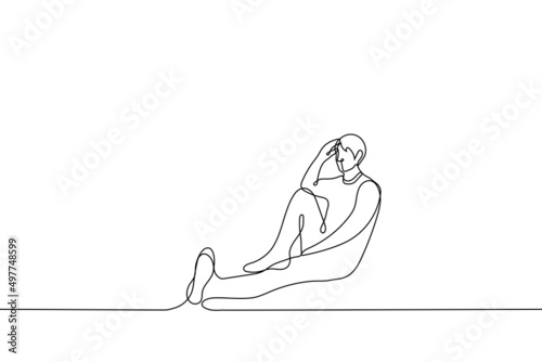 man sits with his back against the wall, he is relaxed - one line drawing vector. concept of relaxation, sadness, fatigue, mental grounding