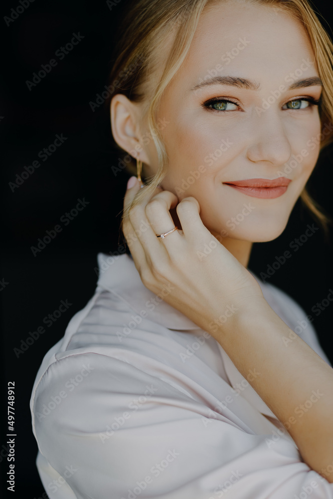 Vertical portrait of a beautiful bride girl on a black background close-up. Vertical portrait of a beautiful bride girl on a black background close-up.