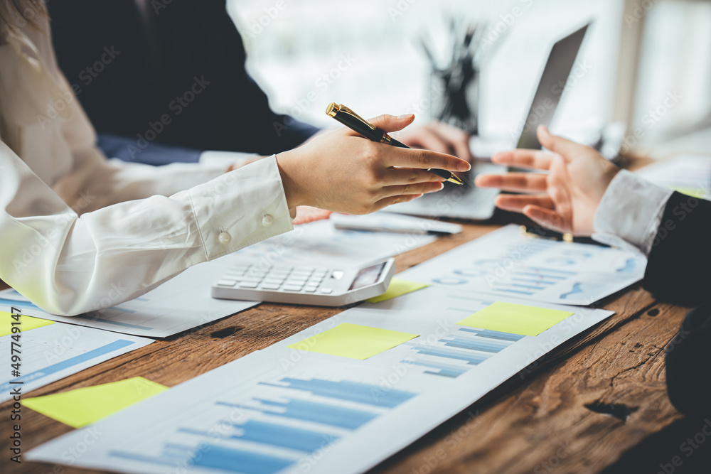 Teamwork with price chart analyzes business people on the table at the conference room. Teamwork with price chart analyzes business people on the table at the conference room.