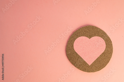 Valentine s day. Love Fashion Love Concept. Love icon on wooden circle cut over pink pastel background with copyspace for put text or logo.
