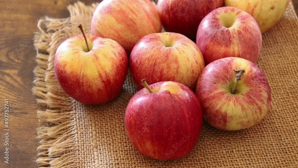 view of red apples isolated on a burlap
