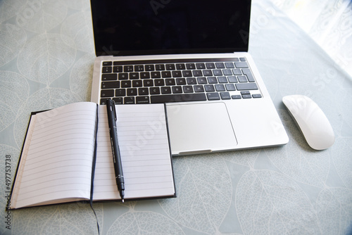 notebook and pen on table