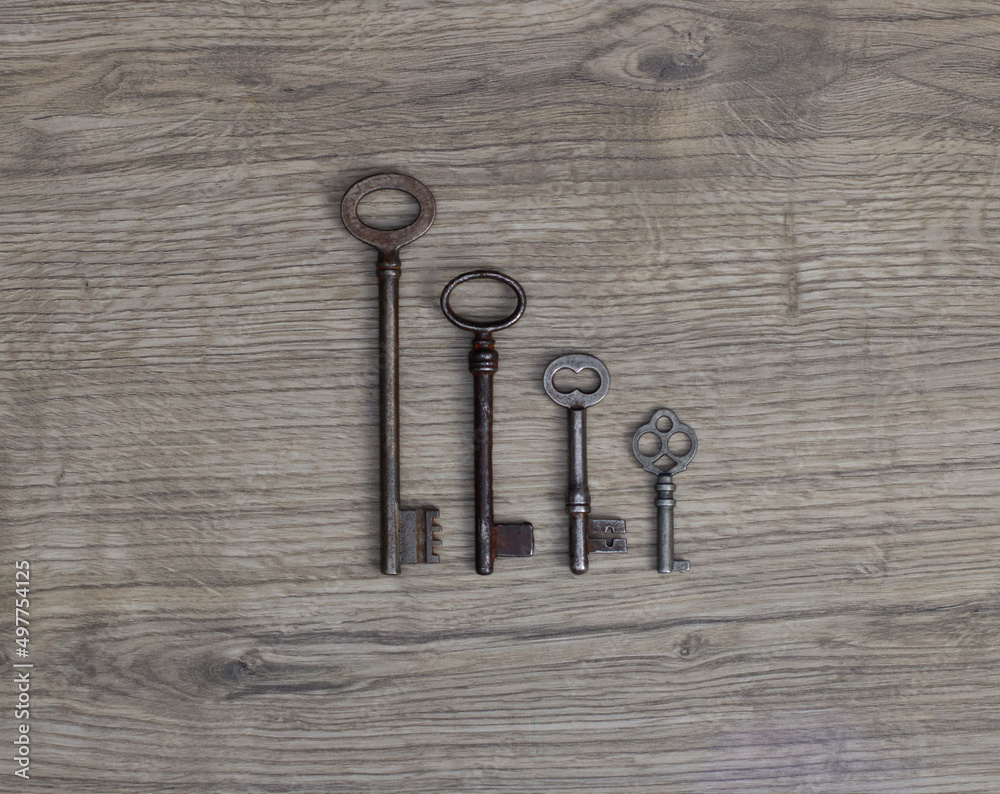 Old keys on a wooden background. Old keys on a wooden background.