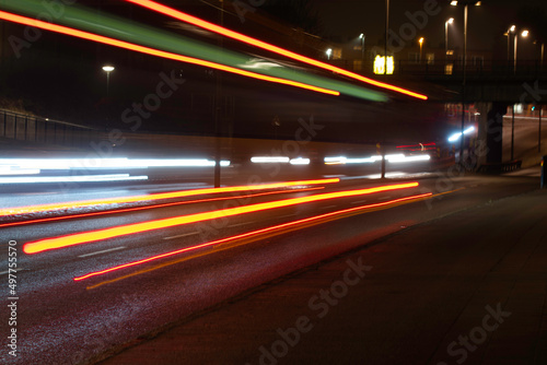 Long exposure photo of traffic driving in evening