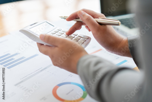 Business analyst concept the accountant calculating to estimate the amount of company’s expense