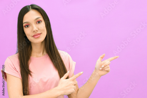 Image of happy young lady standing isolated on lilac background.