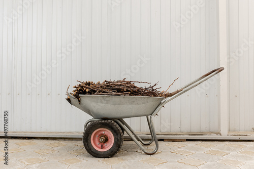 Branches in a cart. Household