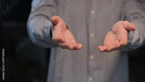 Shaking palms of a man suffering from essential tremor close-up.Parkinson's disease.