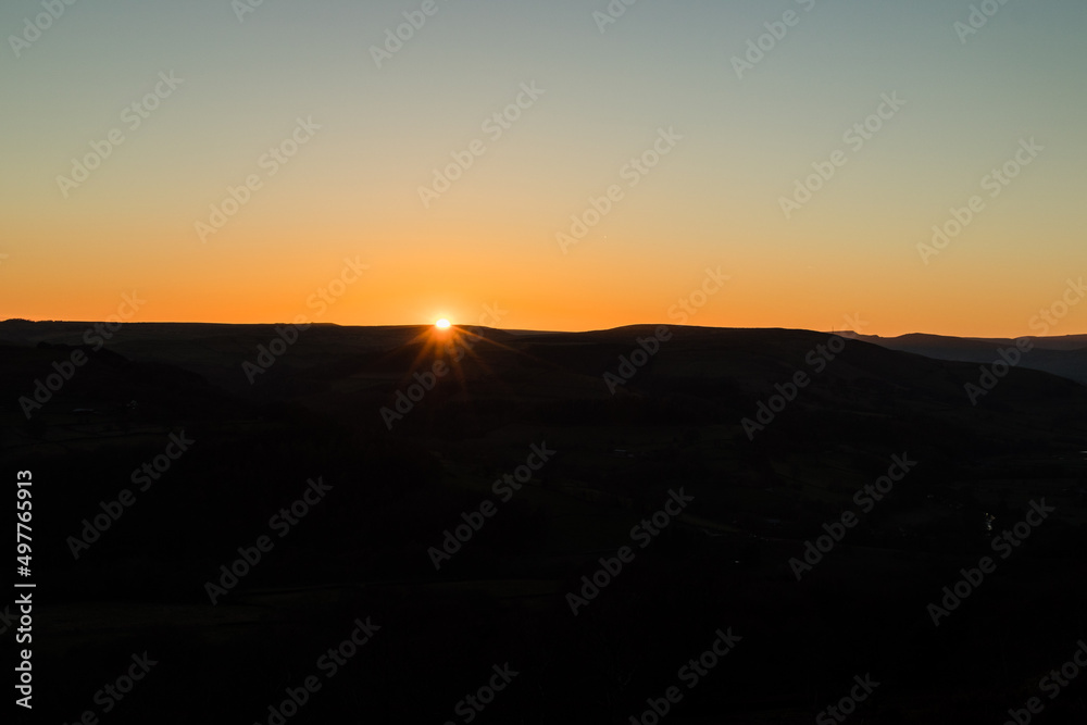 Sunset on the edge of a hillside