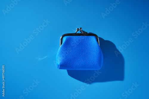 blue coin purse against blue background photo