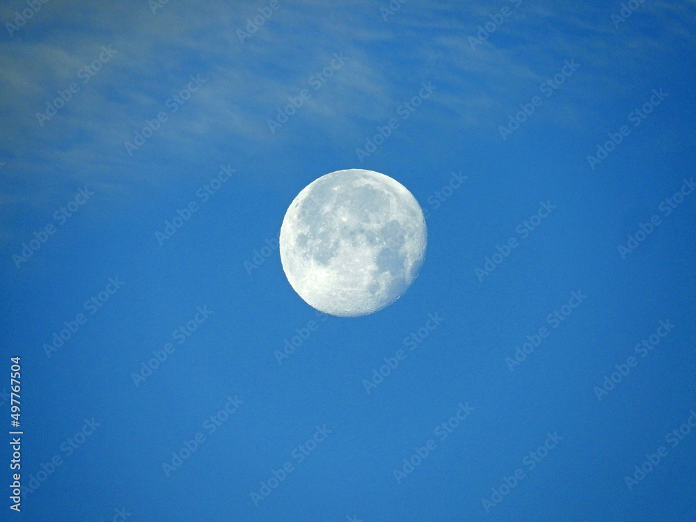 full moon in the sky with clouds