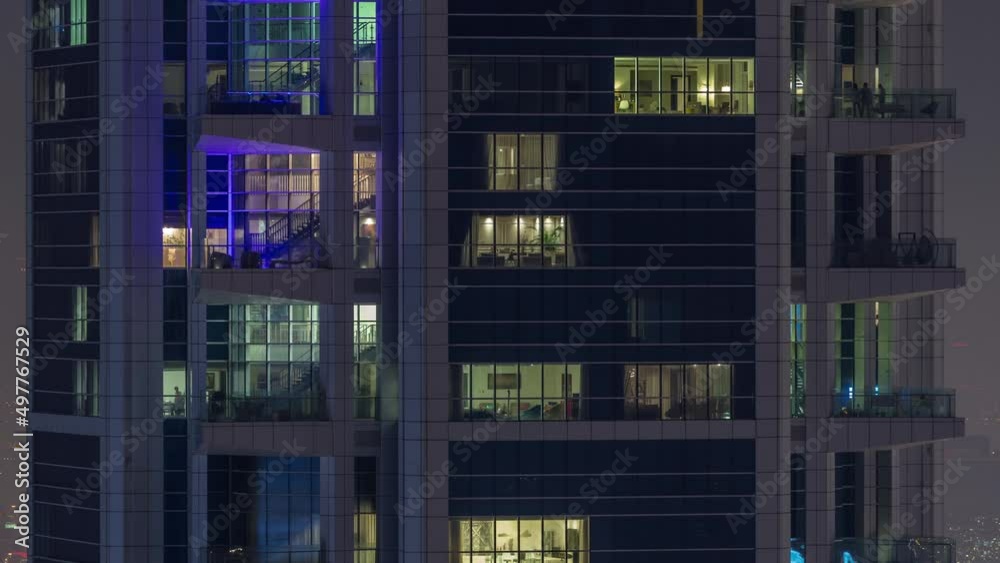 Windows in high-rise building exterior in the late evening with interior lights on timelapse Windows in high-rise building exterior in the late evening with interior lights on timelapse