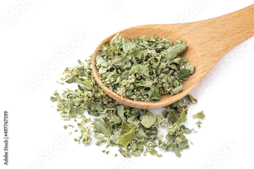 Dried marjoram in a wooden spoon isolated on white background, closeup, herbs