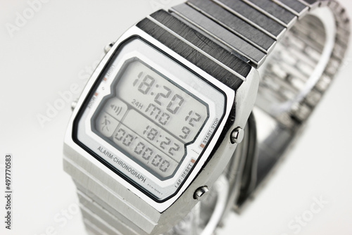 digital watch silver vintage retro wristwatch 70s 80s isolated alarm multifunctional chronograph scratched steel used made in japan rare worn
on watch stand Armbanduhr chronograph side view closeup photo