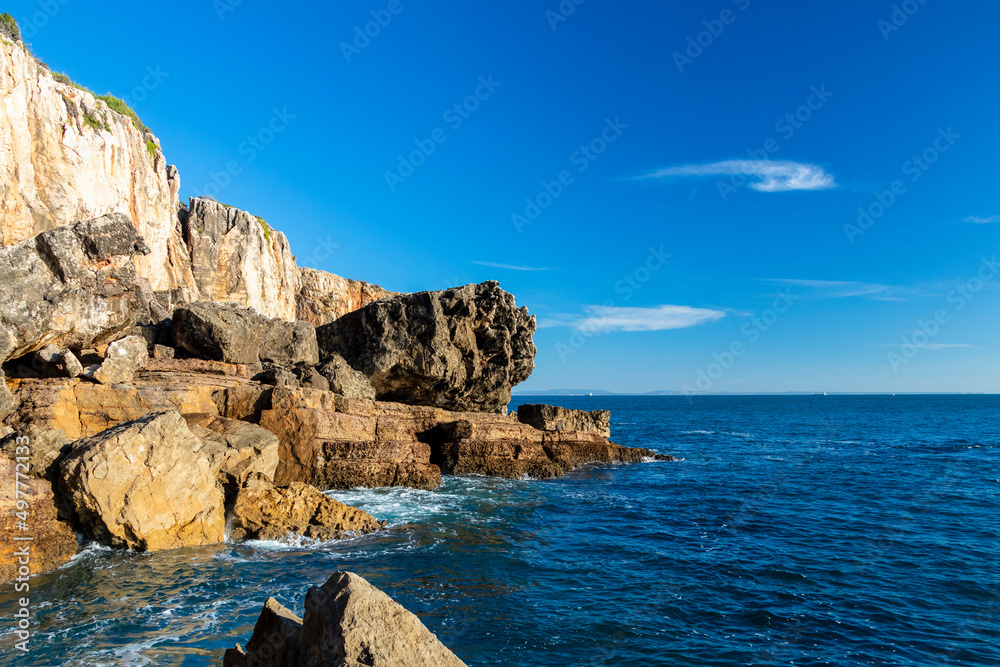 Cliffs with fallen rock cliff and formations of Cabo da Guia, next to Cascais and Lighthouse Farol da Guia, Lisbon, Portugal Cliffs with fallen rock cliff and formations of Cabo da Guia, next to Cascais and Lighthouse Farol da Guia, Lisbon, Portugal
