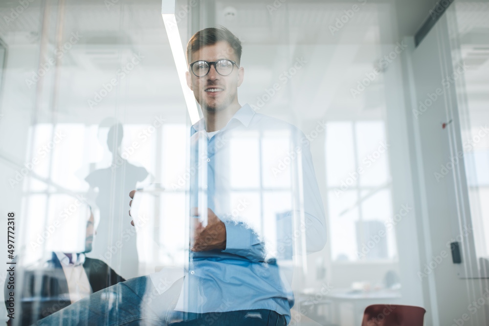 Half length portrait of confident male entrepreneur in optical spectacles for provide eyes correction looking at camera during working day in office interior, Caucasian businessman in glasses posing Half length portrait of confident male entrepreneur in optical spectacles for provide eyes correction looking at camera during working day in office interior, Caucasian businessman in glasses posing