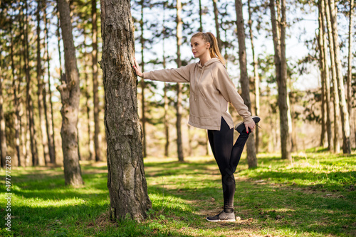 Woman enjoys exercising in the nature.