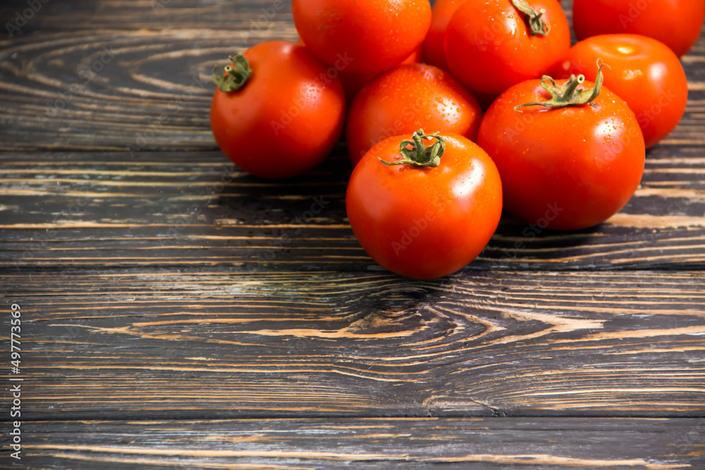 ripe tomatoes on wooden background ripe tomatoes on wooden background