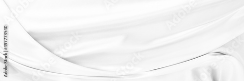 White gray satin texture that is white silver fabric silk panorama background with beautiful soft blur pattern natural.