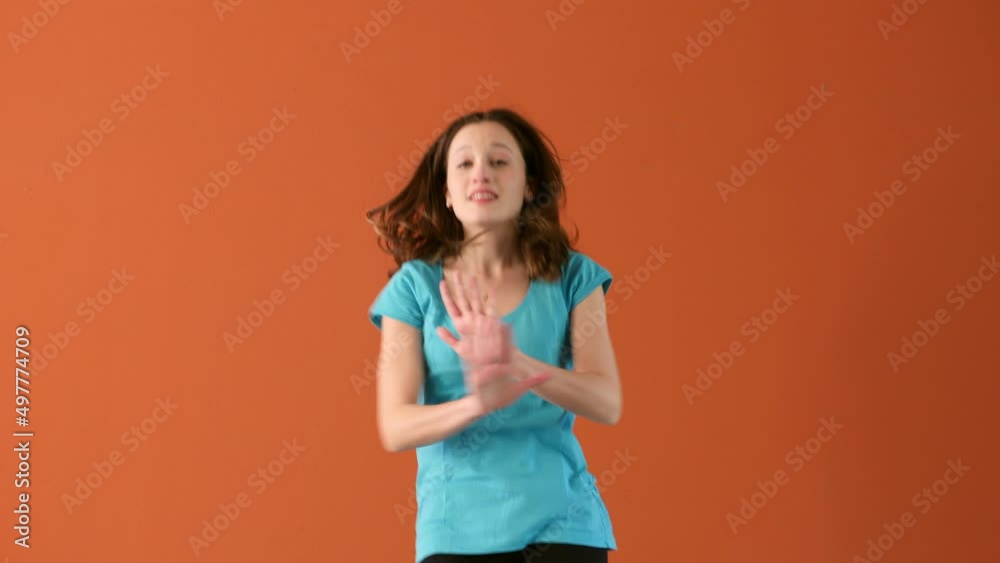 athletic young woman dances in front of the camera performing synchronized steps athletic young woman dances in front of the camera performing synchronized steps