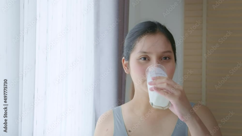 Young pregnant woman drinking milk at home, healthcare and pregnancy care Young pregnant woman drinking milk at home, healthcare and pregnancy care