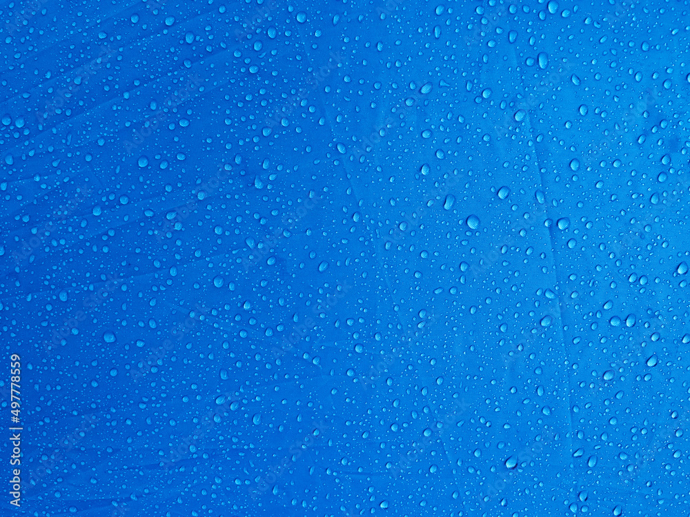 Water drops on waterproof membrane fabric. Morning dew on tent. Water drops on waterproof membrane fabric. Morning dew on tent.