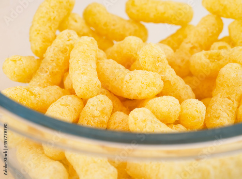 Close-up of Corn puffs in glass bowl photo