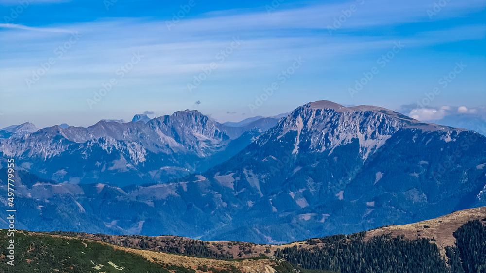 Panoramic view from Seckauer Zinken in the Lower Tauern mountain range, Styria, Austria, Europe. Eisenerz Alps in the distance. Sunny autumn day in the Seckau Alps. bare and rocky terrain. Wanderlust