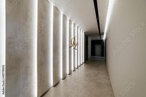 bright interior of the corridor with lighting and black lamp