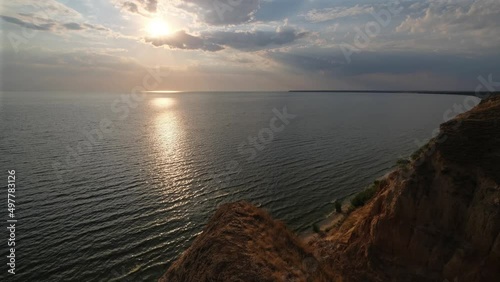 Picturesque sunset view from Stanislav clay mountains and canyons above Dnipro river bay near the Black sea, Ukraine, Kherson Grand Canyon.
