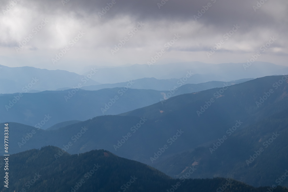 Panoramic view on Mur valley from Seckauer Zinken in the Lower Tauern in Styria, Austria, Europe. Cloudy autumn day in Seckau Alps. Hiking trail on dry and bare grassland terrain. Soft hills