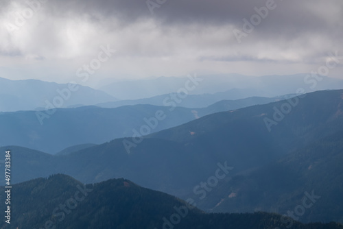 Panoramic view on Mur valley from Seckauer Zinken in the Lower Tauern in Styria, Austria, Europe. Cloudy autumn day in Seckau Alps. Hiking trail on dry and bare grassland terrain. Soft hills