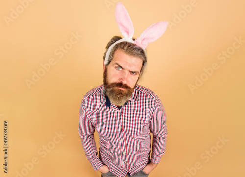 Easter day celebration. Serious bearded man in bunny ears. Rabbit guy. Easter party.