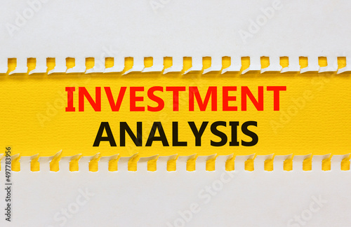 Investment analysis symbol. Yellow and white paper with concept words Investment analysis on beautiful white background. Business investment analysis concept. Copy space.