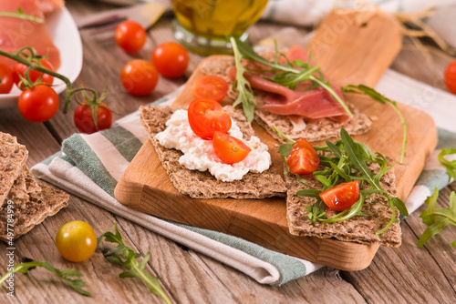 Crispy rye bread with sesame seeds  ham and cottage cheese.