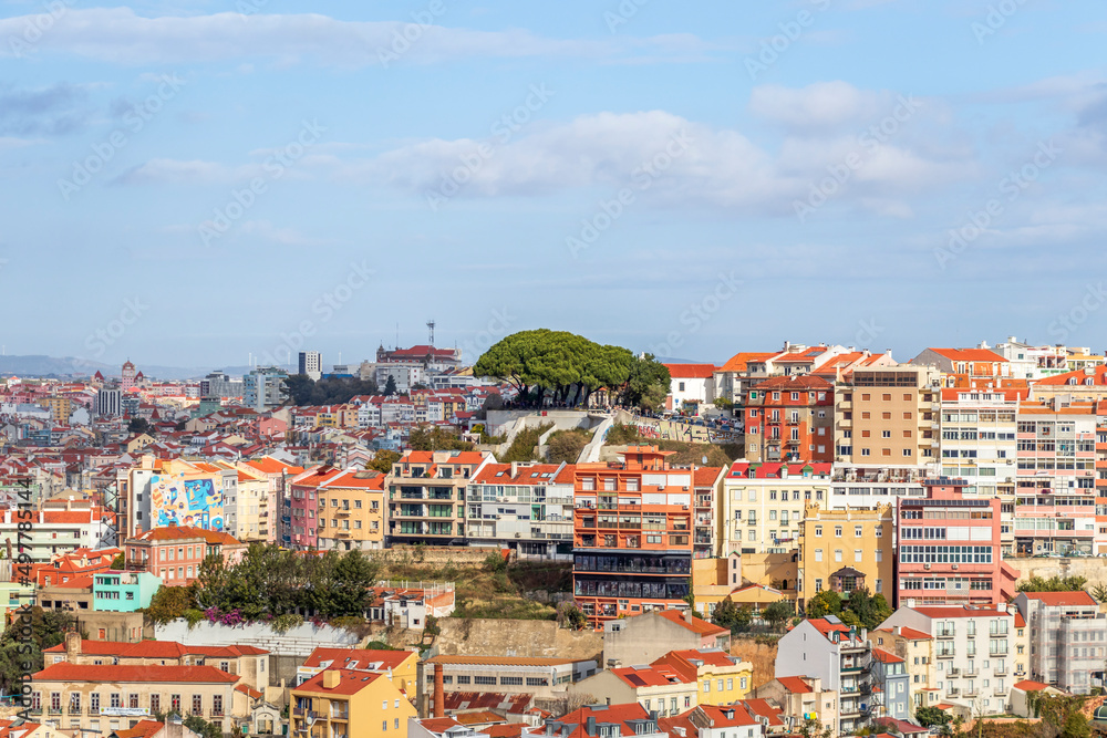 The view from miradouro, observation viewpoint of Lisbon, old architecture with red roofs in Lisbon, Portugal