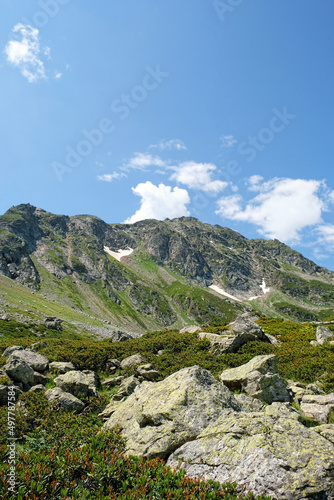 beautiful summer landscape with big mountains against blue cloudy sky, green natural background. trip, journey, hiking, adventure concept. Caucasus mountains, Karachay-Cherkess Republic. Arkhyz © Ju_see