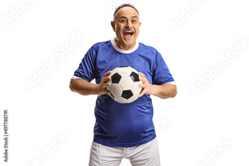Cheerful mature man in a football jersey holding a ball