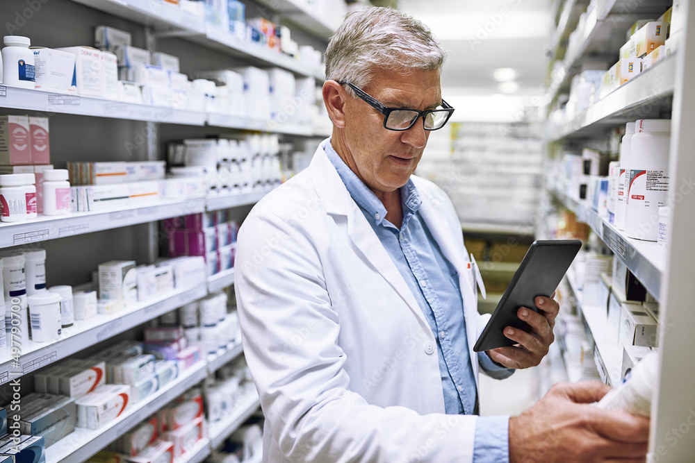 I might actually take some of this later. Shot of a focused mature male pharmacist making notes of the medication stock on the shelves in a pharmacy. I might actually take some of this later. Shot of a focused mature male pharmacist making notes of the medication stock on the shelves in a pharmacy.