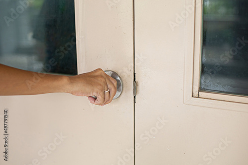 Woman opening or closing the door with her hand © โทวสิษฐ์ คงทน