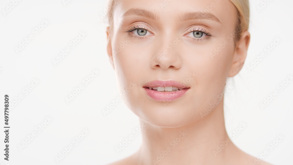 Big close-up beauty portrait of young Caucasian woman with perfect skin on white background | Skin care ad