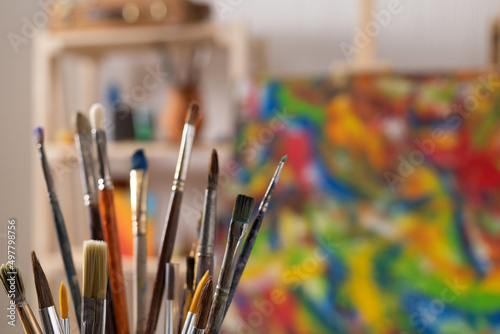 Paint brush and art painter tools at wood background. Paintbrush for painting in artist studio